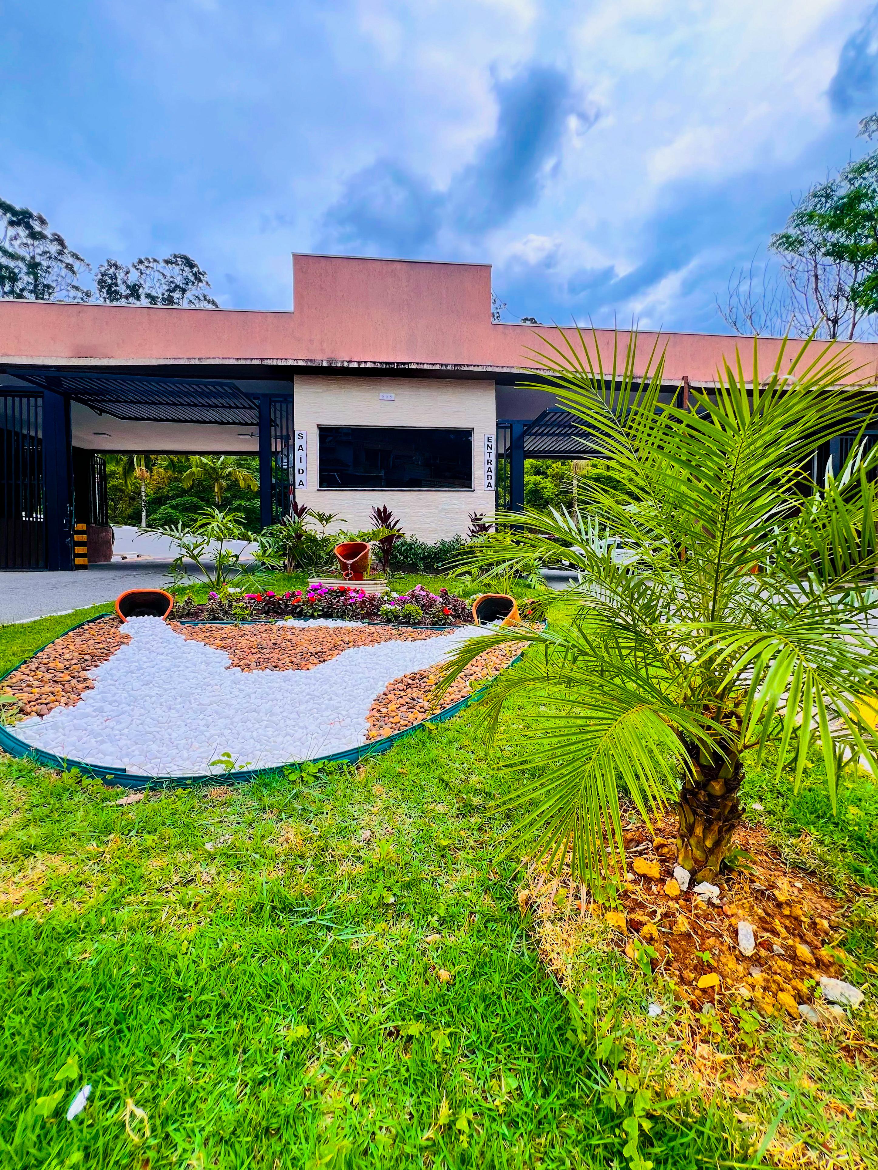 Entrada do Real Park RP - Portaria do condomínio com paisagismo